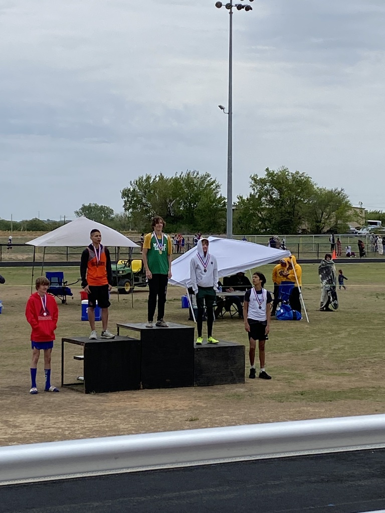 Boy on top of medal stand